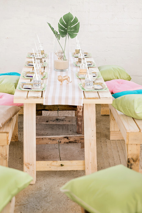 Rustic wooden table and benches with colour matching cushions and runners for hire.