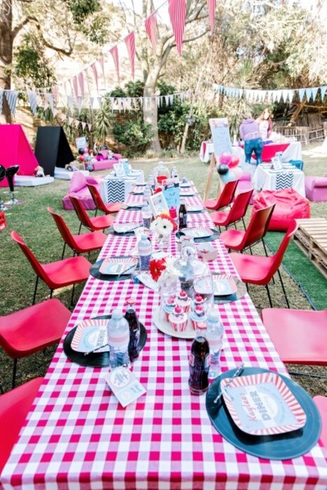 Retro steel and plastic chairs for hire, with fifties style table cloths,