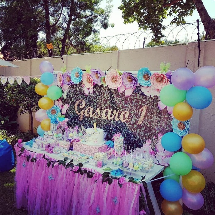 The candy table setup for Gazaro's Floral Butterflies party.